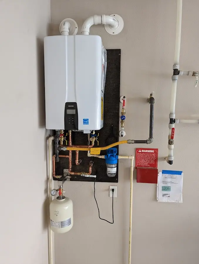 Professional plumber installing copper piping in a Yreka home